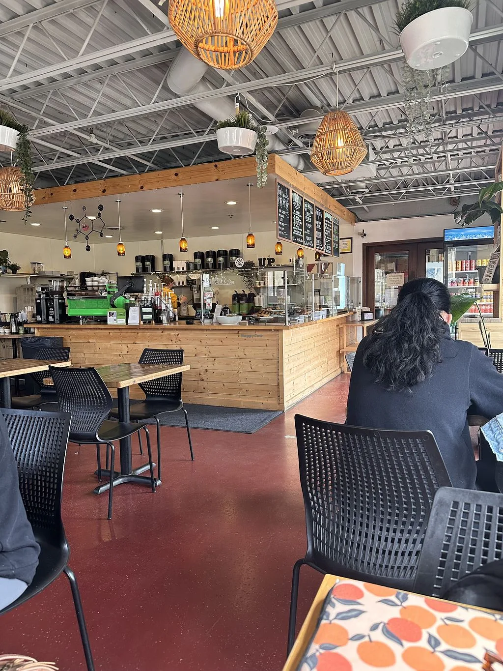 modern café interior with wooden counter, woven pendant lights, and industrial ceiling., up coffee roasters, minnesota