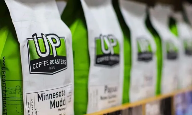 up coffee roasters bags lined up, minnesota mudd blend visible, bright green and white packaging., up coffee roasters, minnes