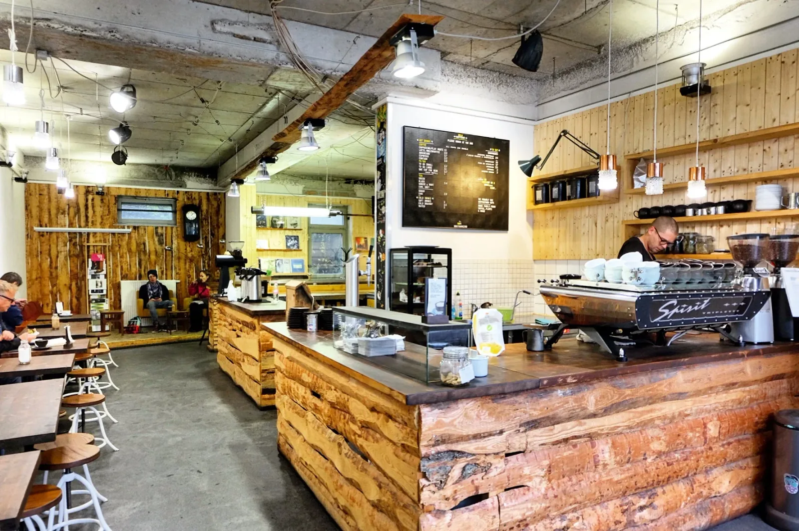 rustic coffee shop interior with wooden counters and industrial aesthetic., verdensbakeriet oslo, oslo