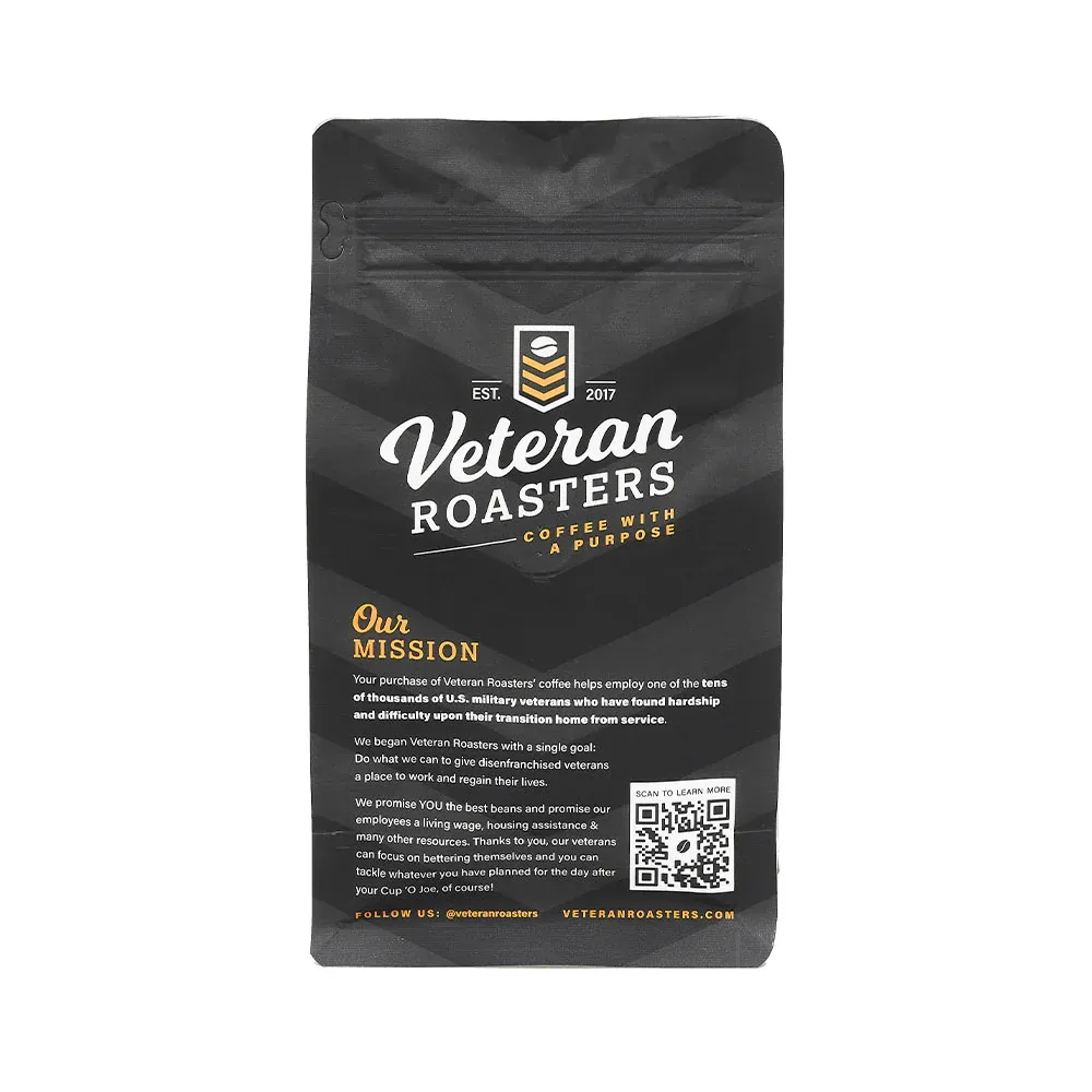 black coffee bag with white and gold veteran roasters branding and mission statement text., veteran coffee roasters, colorado