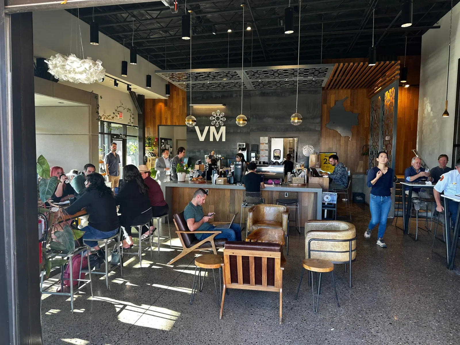 modern coffee shop interior with customers, counter service, and mid-century furniture., villa myriam coffee, albuquerque