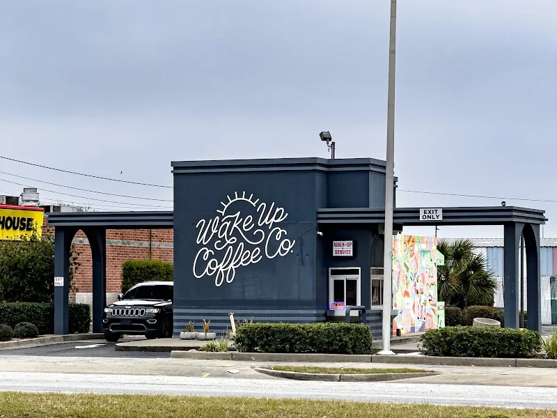 wake up coffee co storefront with dark blue building and carport structure., wake up coffee company, brunswick