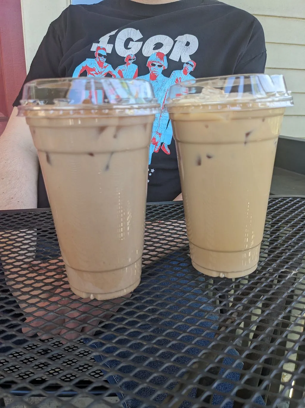 two iced coffee drinks with plastic straws on a metal table., walden's coffeehouse, reno