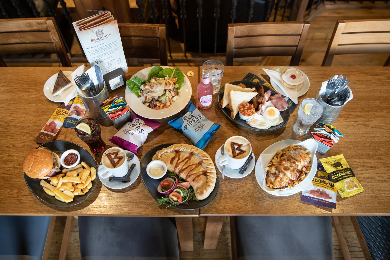 table display of british pub food including burgers, pies, fries, and breakfast items., warhammer world, nottingham