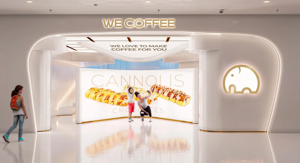 modern coffee shop storefront with neon signage and cannoli display interior., we coffee shopping eldorado, são paulo