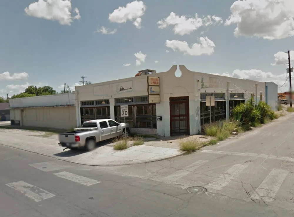 abandoned beige commercial building with white pickup truck parked outside., white elephant coffee company, texas