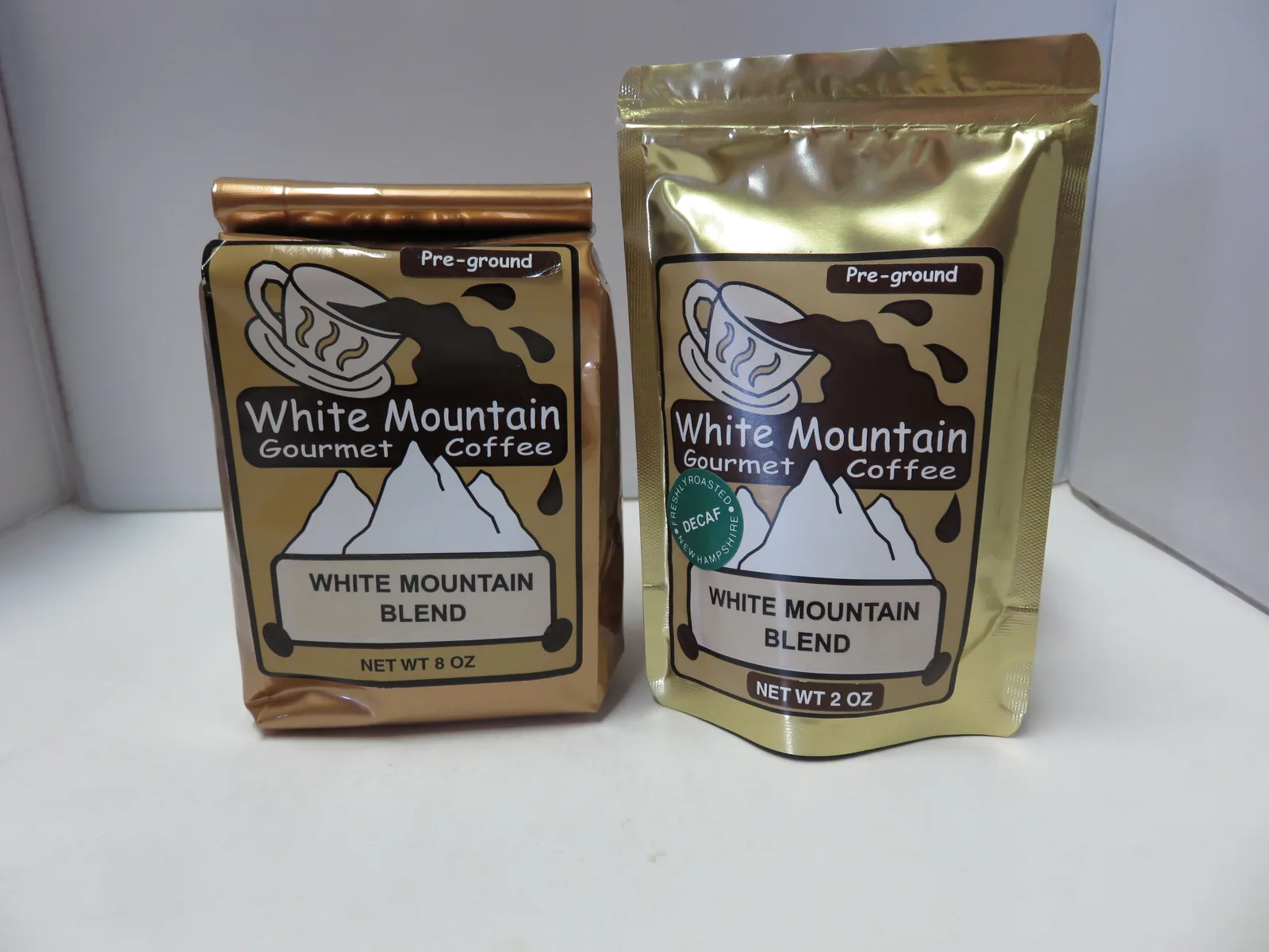 two bags of white mountain gourmet pre-ground coffee in different sizes displayed side by side., white mountain gourmet coffe