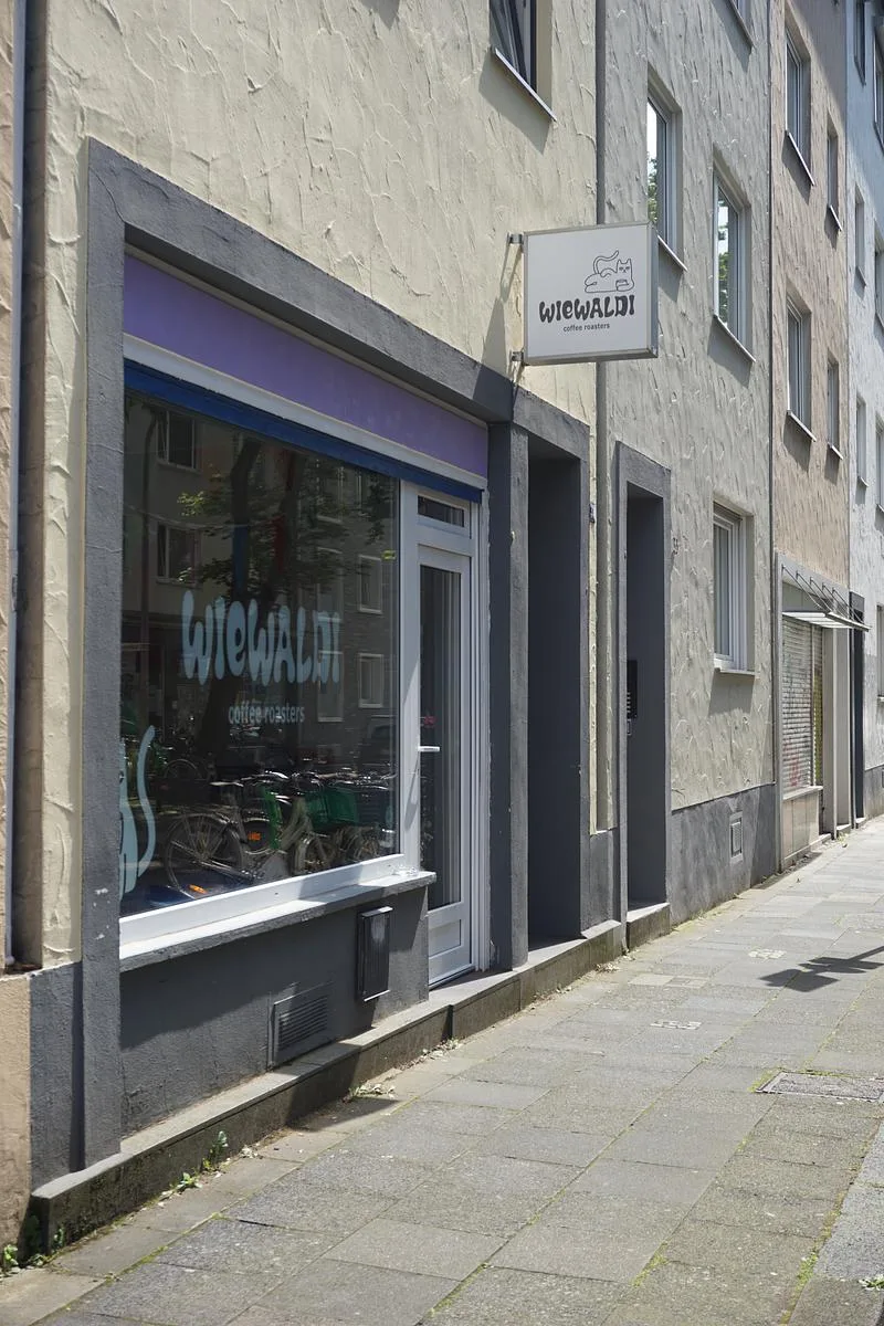 wiewaldt coffee roasters storefront with purple awning and bicycles visible inside., wiewaldi coffee roasters, cologne