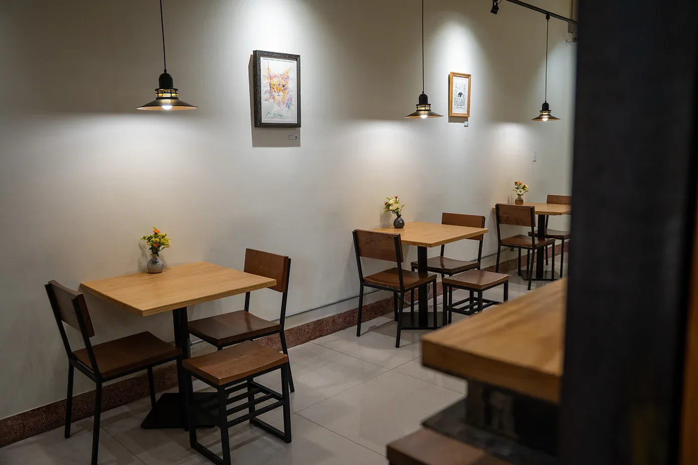 modern café interior with wooden tables, brown chairs, and pendant lighting., yabane coffee, taichung
