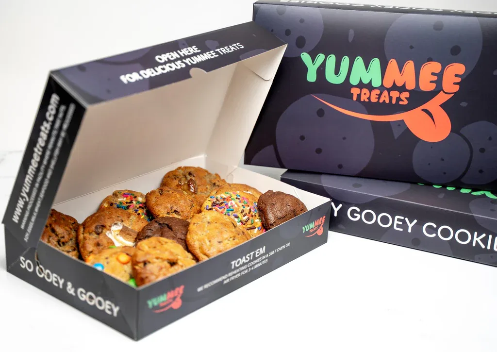 yummee treats branded cookie boxes displaying assorted colorful decorated cookies in open packaging., yummee treats, madison